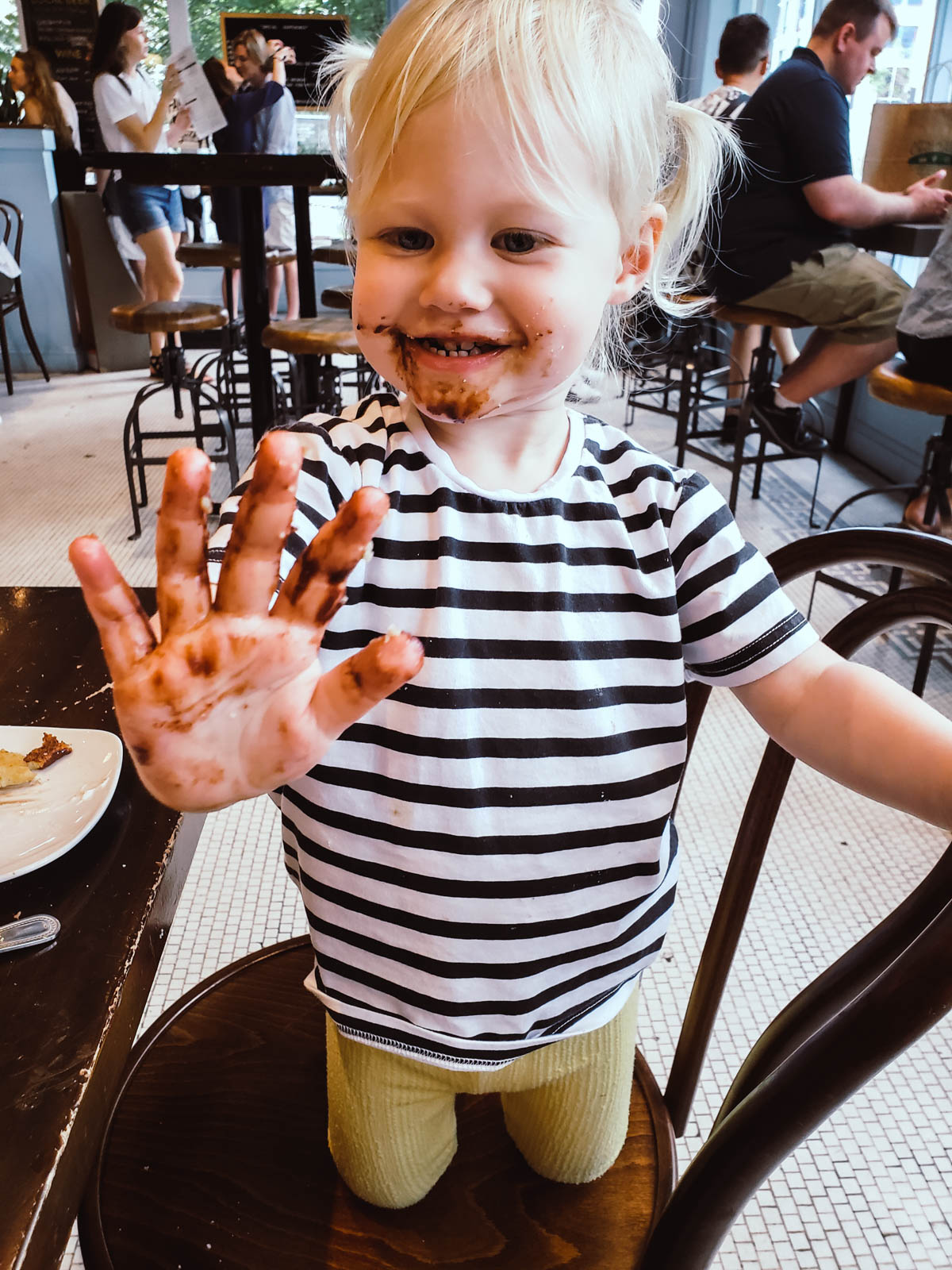 Toddler covered in chocolate