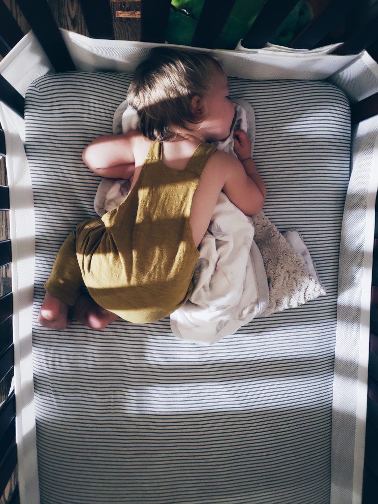 Baby sleeping in a made in USA romper.
